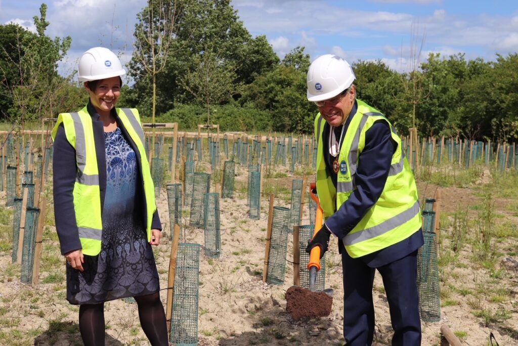 David Allam wields the spade at the Hailsham site