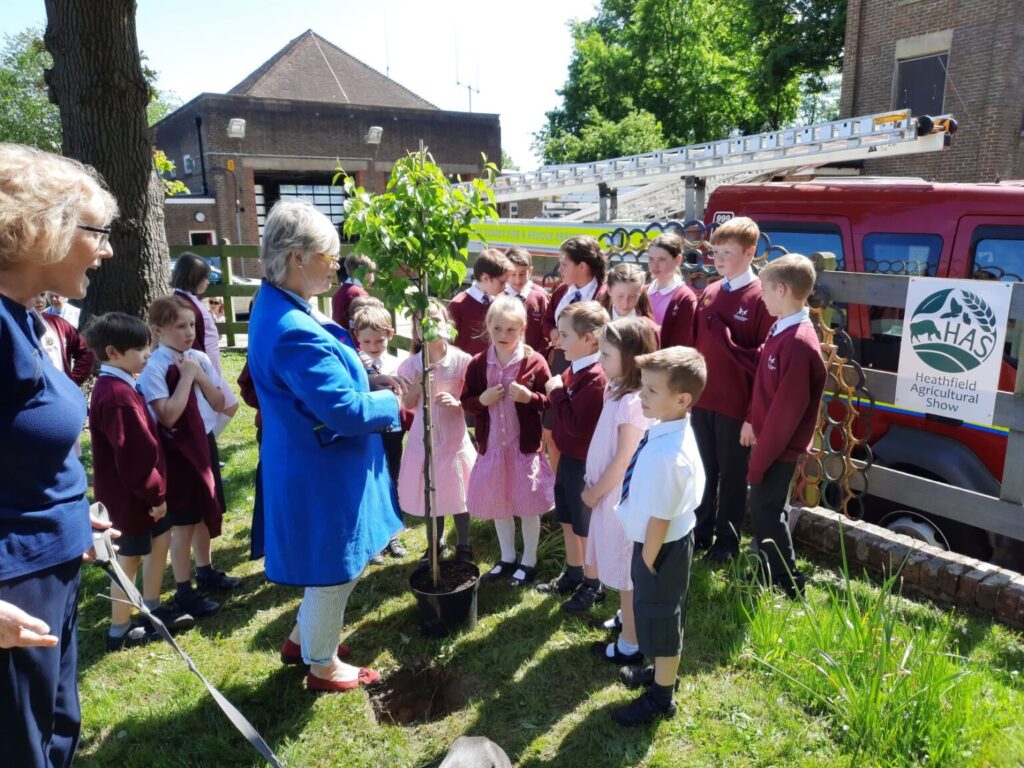 School children at tree planting ceremony at Heathfield Fire Station